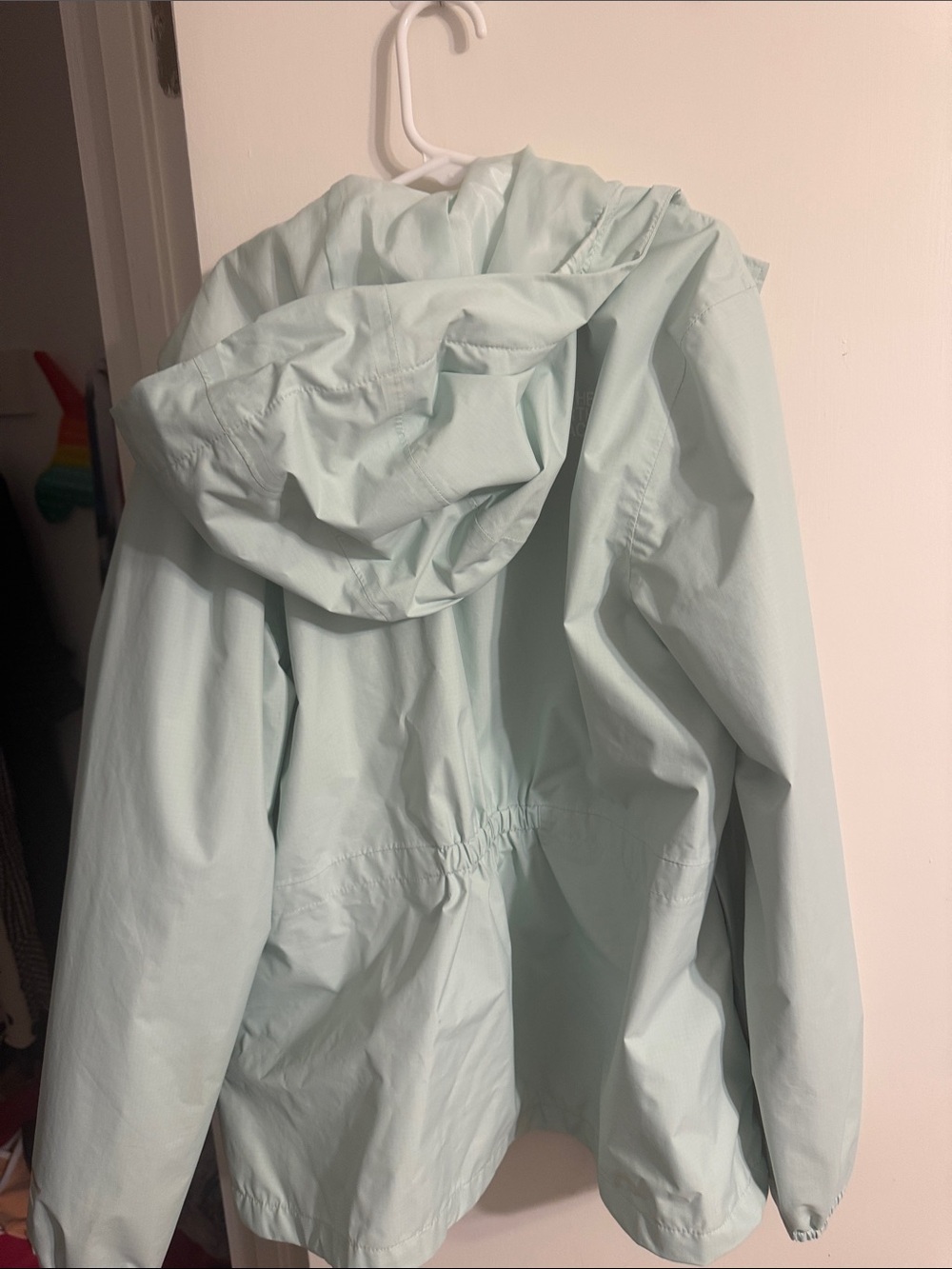 The North Face girl’s Light Mint Hooded Rain Jacket